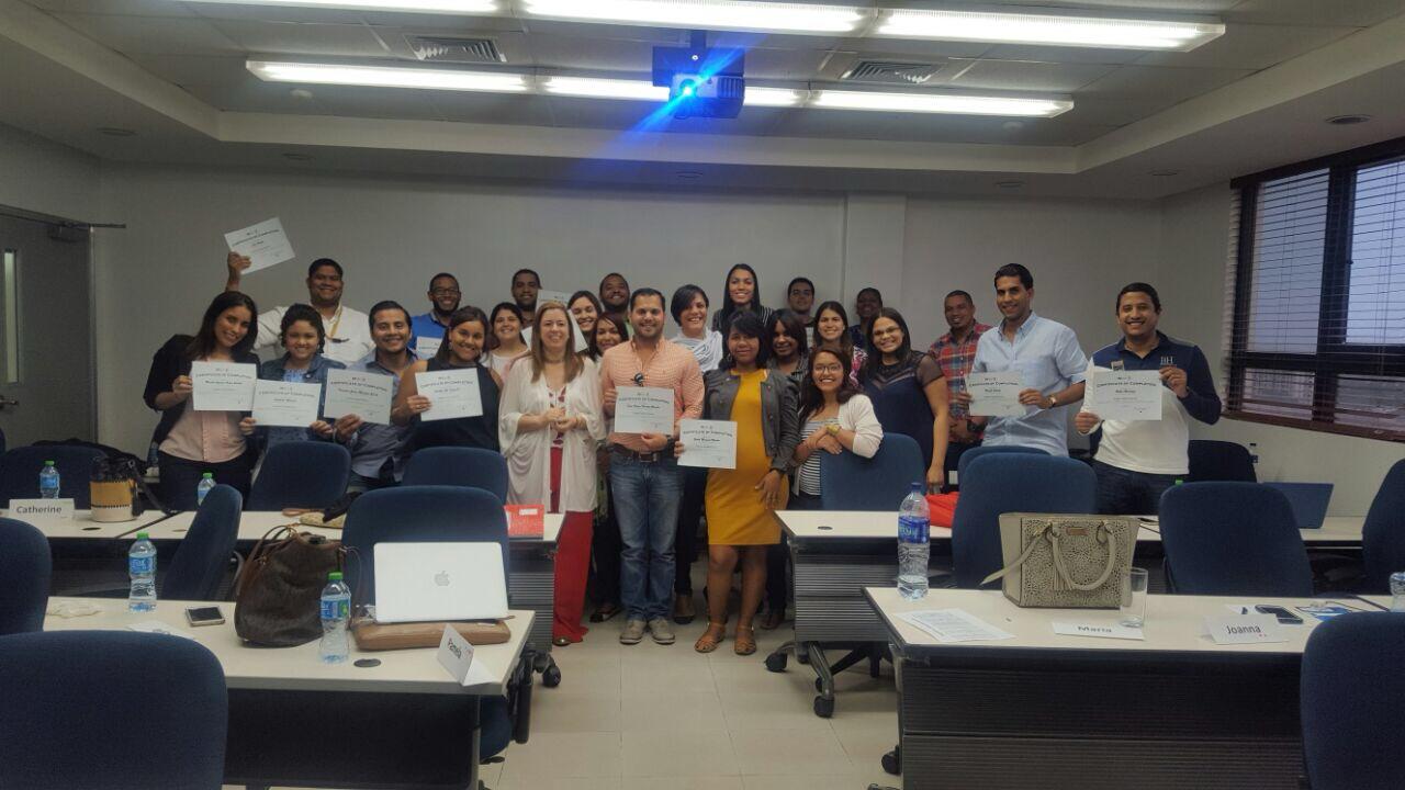 Graduates of an in-person ATA cohort holding their certificates
